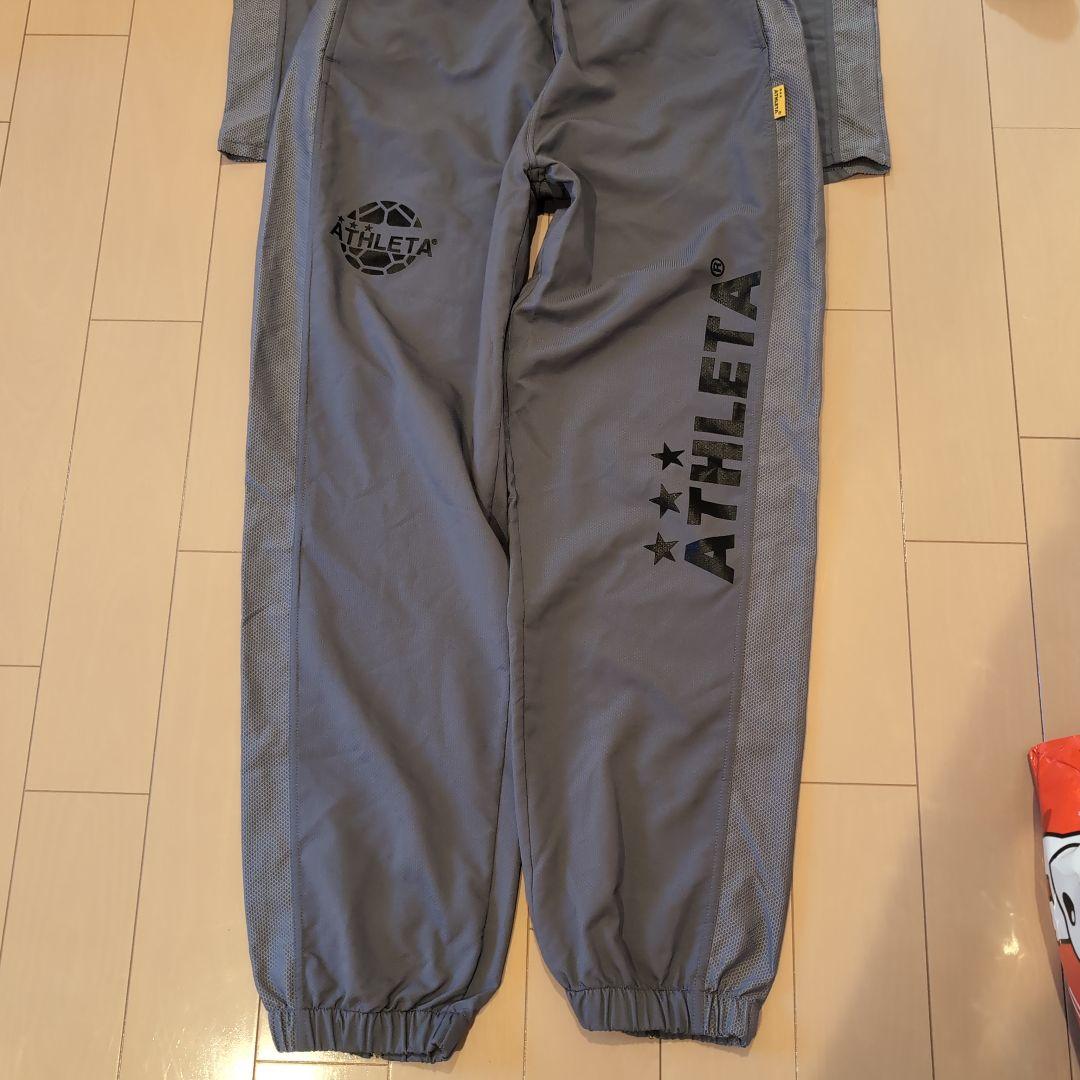 ATHLETA グレー ピステ・ウィンドブレーカー