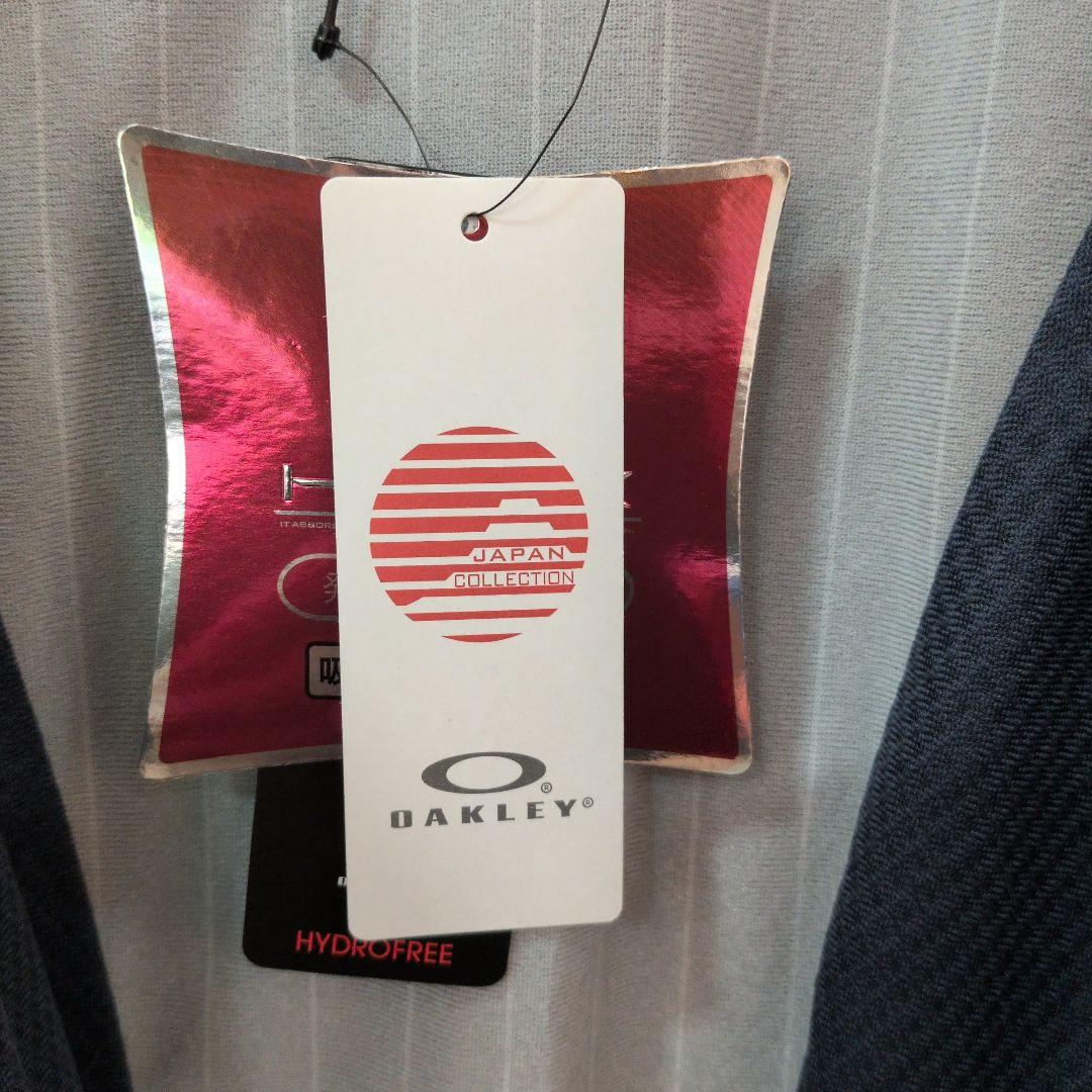 新品タグ付オークリー　ゴルフ　ウィンドブレーカー　XL パープル