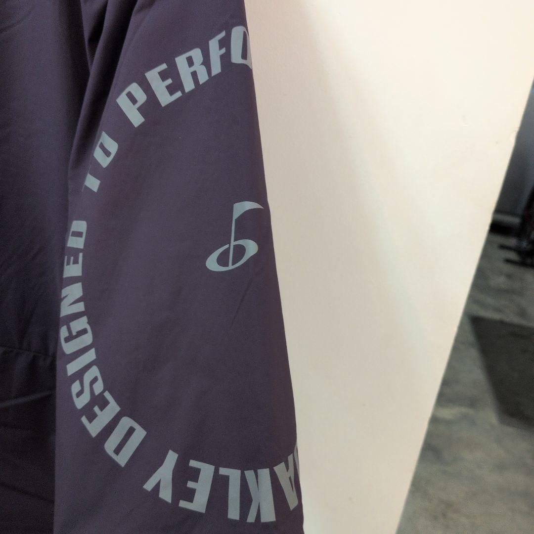 新品タグ付オークリー　ゴルフ　ウィンドブレーカー　XL パープル