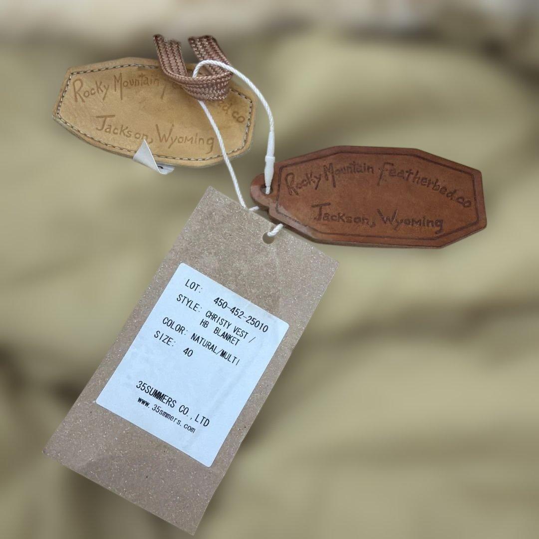 t*a様 未使用品タグ付自宅保管ロッキーマウンテン限定ダウンベスト40サイズ