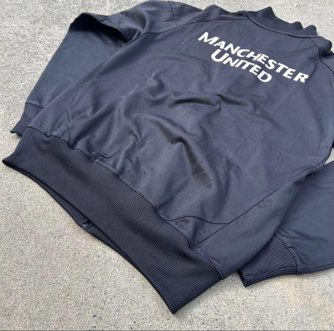 【希少】マンチェスター・ユナイテッド トラックジャケット L相当 黒 ロゴ刺繍