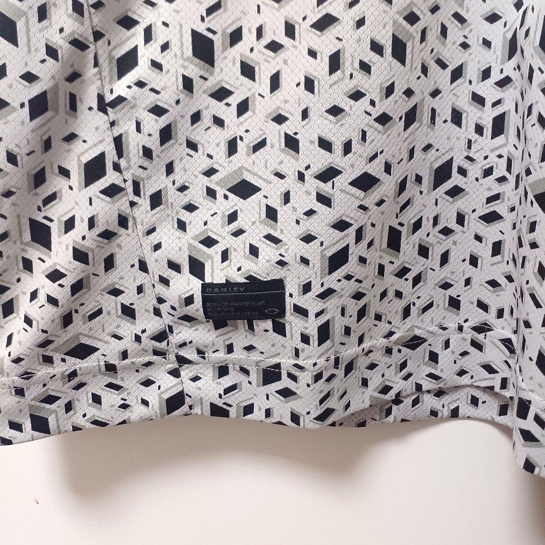 オークリーゴルフ　メンズ　半袖ポロシャツ　ホワイト系　L　総柄　スカル