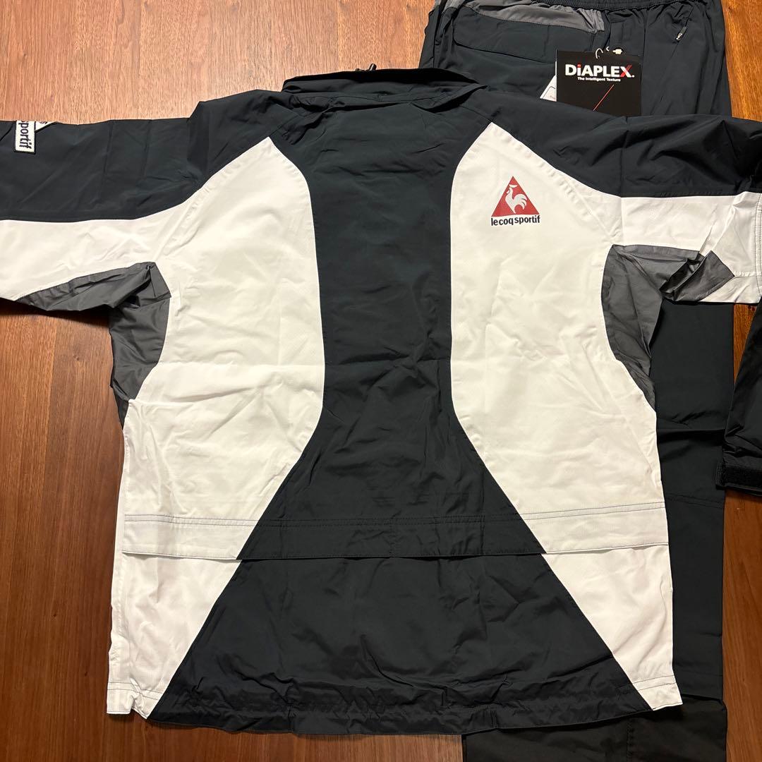 SALE 新品タグ付 ルコックゴルフ上下セット レインウェアL　　袋付 黒白