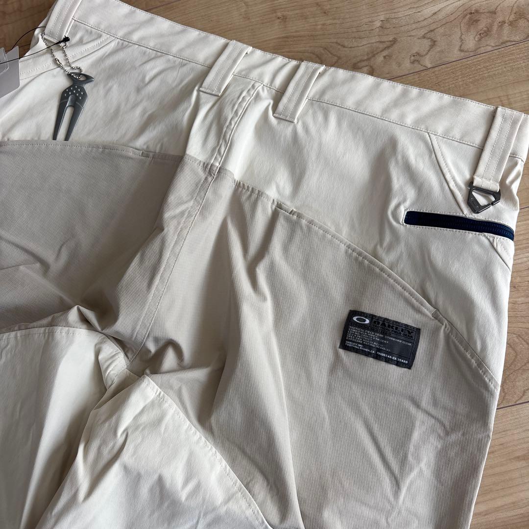 新品　オークリー　メンズ　ゴルフ　ストレッチ　ゆったり　通年用　撥水　防風　36