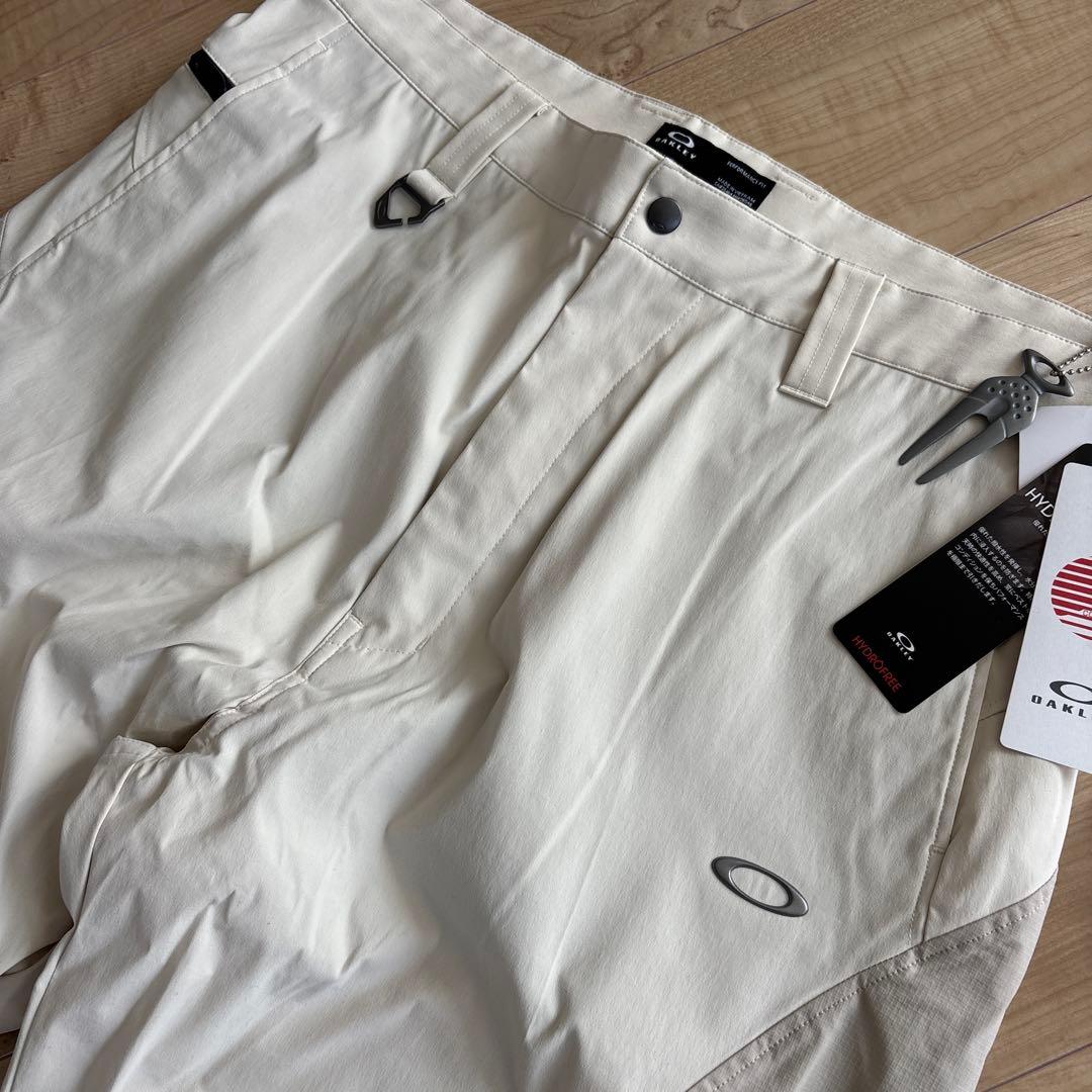 新品　オークリー　メンズ　ゴルフ　ストレッチ　ゆったり　通年用　撥水　防風　36