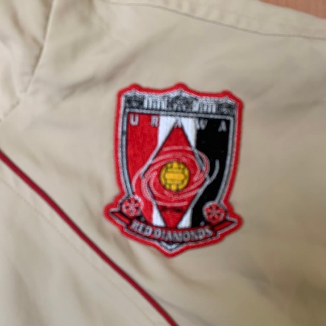 浦和レッズ 選手支給品PUMA ウィンドブレーカー ベージュ・赤　サイズ XO