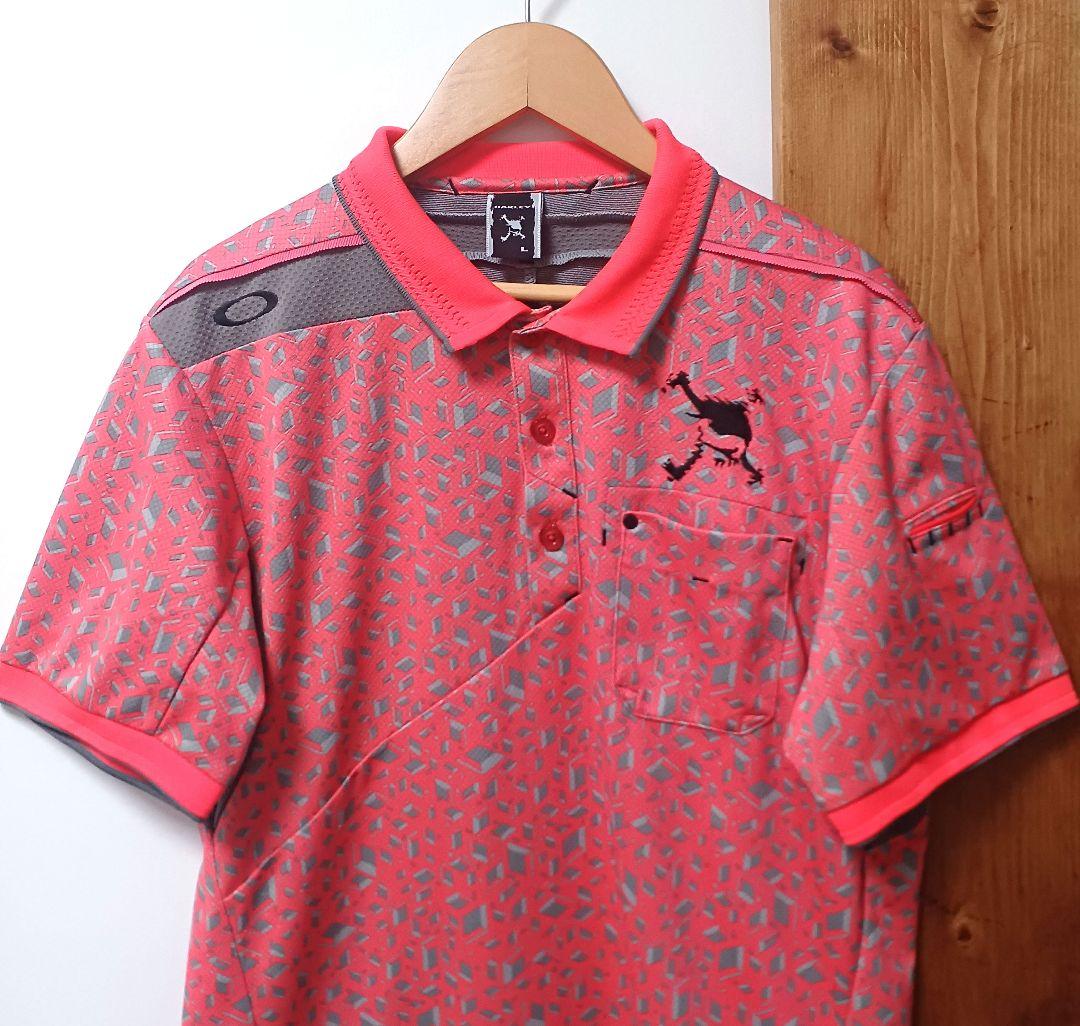 オークリーゴルフ　メンズ　半袖ポロシャツ　オレンジ系　サイズL　スカル　総柄