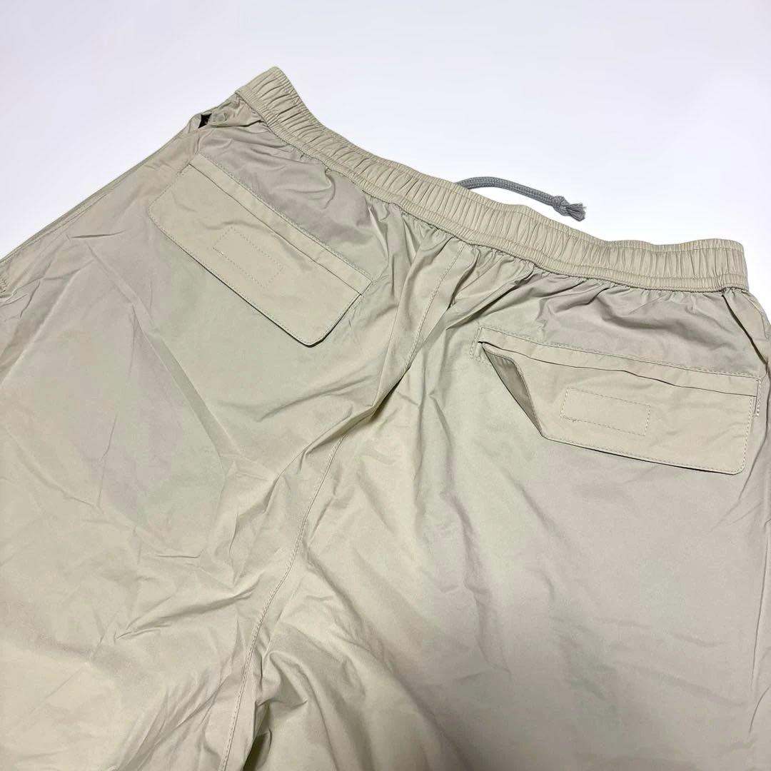 タグ付き未使用　XXIO ゴルフ用レインウェア　ベージュX黒　サイズXL