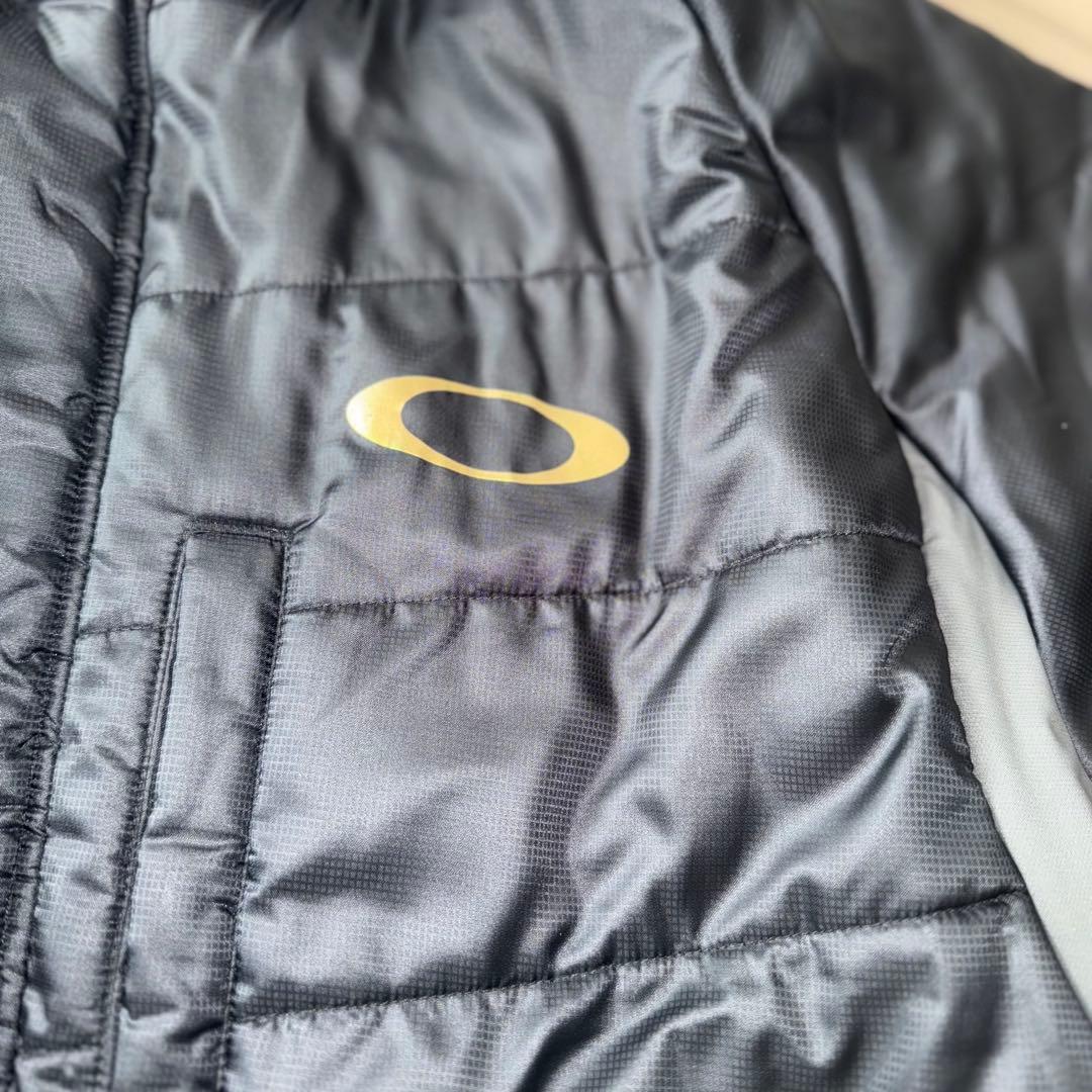 最終値下げ　美品　OAKLEY ベンチコート背面刺繍ビッグサイズ　バッグロゴ　金