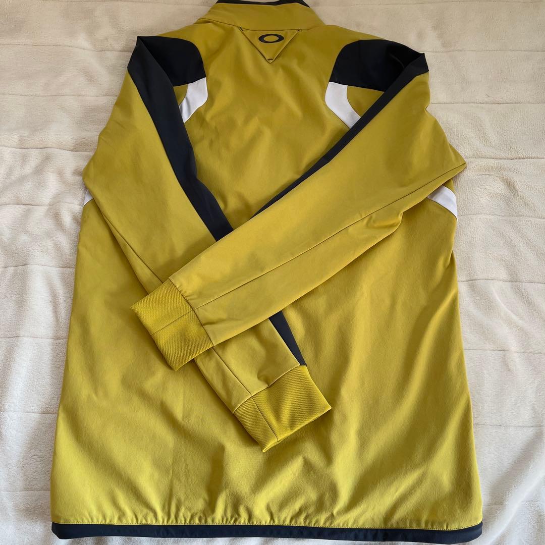 オークリー ゴルフウェア 長袖ウインドブレーカー サイズＬ 黄色 日本正規品